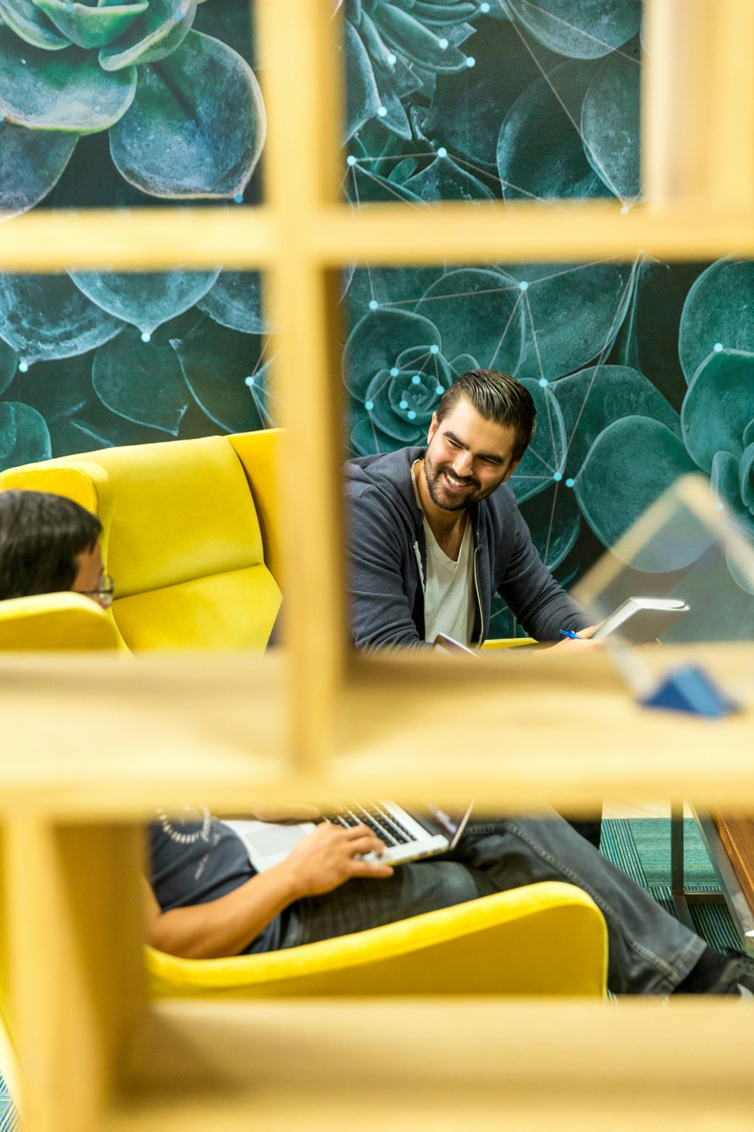 Two colleagues in a creative office space