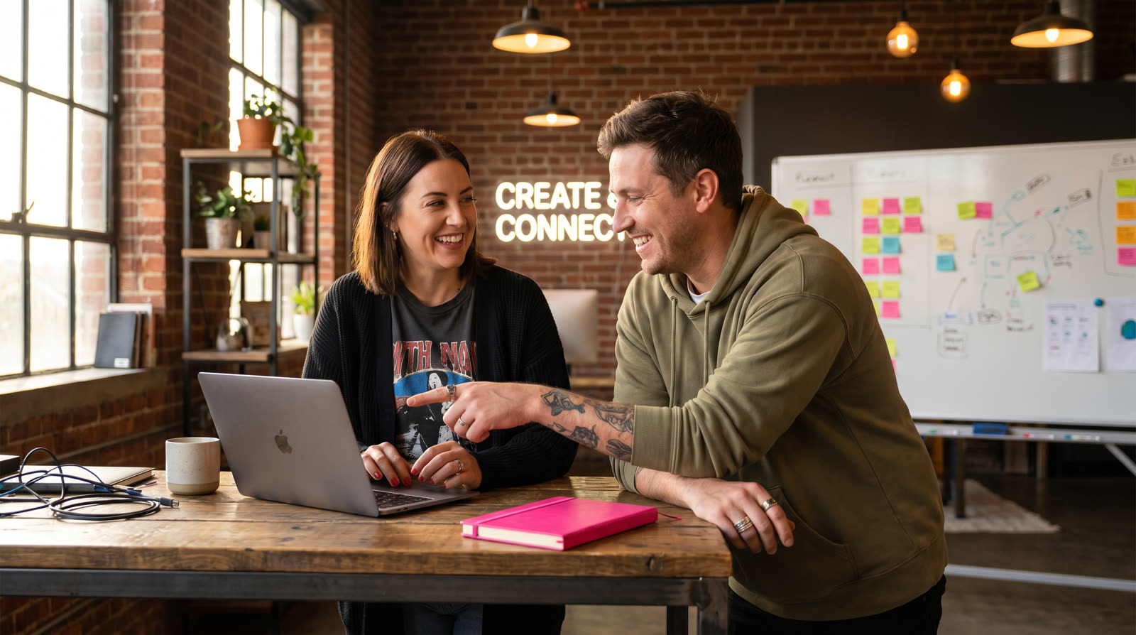 Two affiliate marketers reviewing partner traffic data together